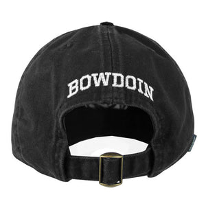 The back view of a black baseball cap showing the brass adjustable buckle closure and the word BOWDOIN embroidered in white over the opening.