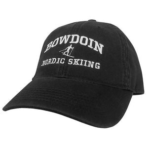 Black twill baseball cap with white embroidery of BOWDOIN arched over an icon of a Nordic skiier over the words NORDIC SKIING.