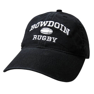 Black twill baseball cap with white embroidery of BOWDOIN arched over a rugby ball over the word RUGBY.