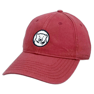 Red baseball cap with needlepointed polar bear mascot medallion.