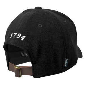 Back view of black wool ball cap showing adjustable brown leather closure with brass buckle, and white embroidered 1794 over the opening.