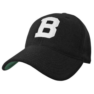 Black wool ball cap with white felt B patch and green under-bill.