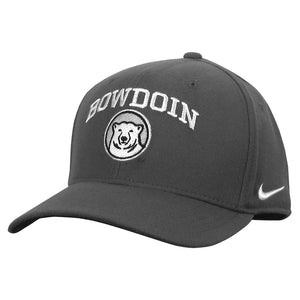 Dark flint grey baseball hat with white BOWDOIN embroidery arched over embroidered mascot medallion.