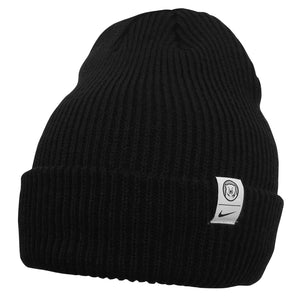 Black knit hat with white tab on cuff with polar bear medallion over a tiny Nike Swoosh.