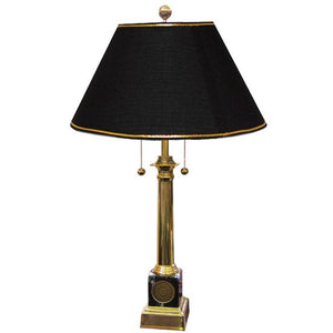 Brass lamp with black maple base accent, embedded with engraved gold Bowdoin seal medallion. Black shade with gold trim.