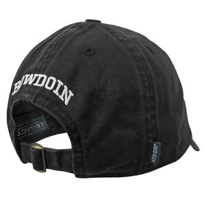 View of black baseball hat from the back, showing arched white BOWDOIN embroidery and brass adjustable closure buckle.