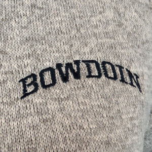 Closeup of black arched BOWDOIN embroidery on oatmeal fleece.