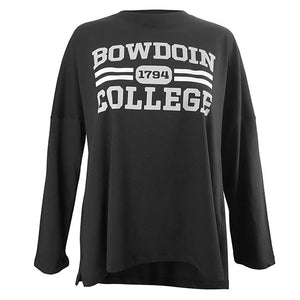 Oversized black long-sleeved tee with imprint of BOWDOIN in grey over two white stripes interrupted by 1794 in a grey cartouche over COLLEGE in grey.