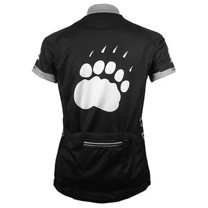Back view of women's cycling jersey, with white paw print on back.