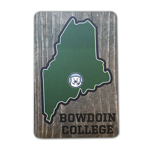 Wood-look refrigerator magnet with a small Bowdoin polar bear mascot medallion within a green stylized State of Maine imprint. The words BOWDOIN COLLEGE are printed in black in the bottom corner.