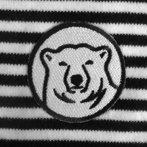 Closeup detail of black and white embroidered mascot medallion patch.