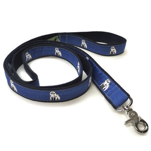 Pet leash with blue silk ribbon facing decorated with repeating Bowdoin polar bear mascot design.