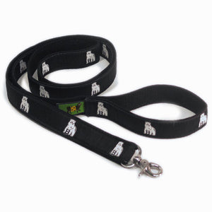 Pet leash with black silk ribbon facing decorated with repeating Bowdoin polar bear mascot design.