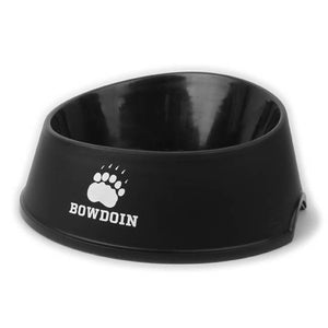 Black plastic dog bowl with white imprint of paw over BOWDOIN.