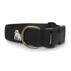 Black dog collar with black ribbon with repeating white Bowdoin mascot decoration. Black plastic clip closure and brass D ring.