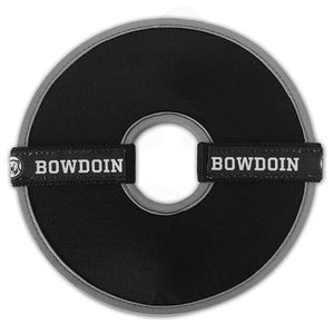 Round black flying disc toy with center cutout. Grey trim on inside, black ribbon with repeating BOWDOIN and mascot medallion sewn to nylon webbing decoration across each half of the disc.