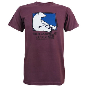 Plum short-sleeved T-shirt with picture of a polar bear sitting against the side of a rectangle with a blue background. Text beneath reads THE PEARY-MACMILLAN ARCTIC MUSEUM, BOWDOIN COLLEGE, BRUNSWICK, MAINE