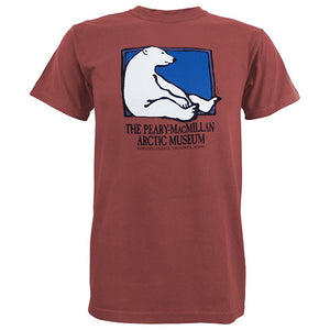 Faded red short-sleeved T-shirt with picture of a polar bear sitting against the side of a rectangle with a blue background. Text beneath reads THE PEARY-MACMILLAN ARCTIC MUSEUM, BOWDOIN COLLEGE, BRUNSWICK, MAINE