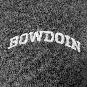 Closeup of white arched Bowdoin embroidery.
