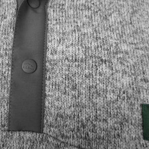 Closeup of placket with gray embossed plastic snaps with L.L.Bean logo.