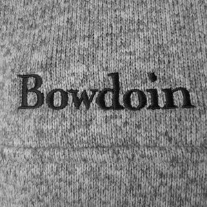 Closeup of black embroidered Bowdoin wordmark.