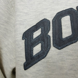 Closeup of blue-grey microsuede BOWDOIN applique.