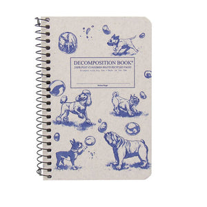 Pocket-sized coilbound Decomposition book with dogs and bubbles on cover.