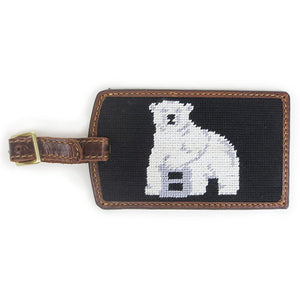 Brown leather luggage tag with brass buckle and needlepointed Bowdoin polar bear mascot backing.