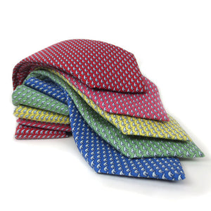 Stack of 5 silk ties in red, raspberry, yellow, green, and blue.
