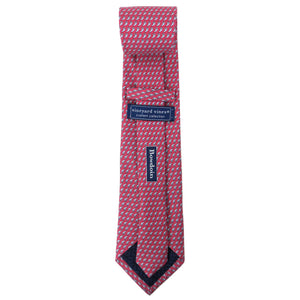 Back view of a raspberry silk tie with an all-over imprint of the Hyde Plaza polar bear showing Vineyard Vines label and Bowdoin wordmark.