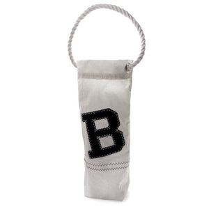 White wine bag with large black B applique and white rope handle.