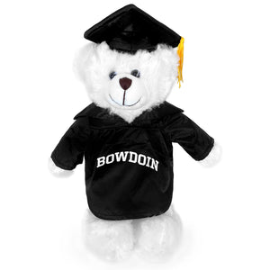 White plush bear with black cap and gown. Gown has BOWDOIN imprinted in white on the chest.