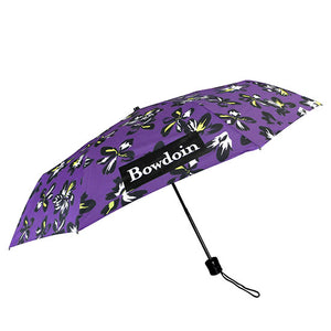 Purple umbrella with black, white, and yellow hibiscus floral print all over, and rectangular BOWDOIN wordmark imprint.