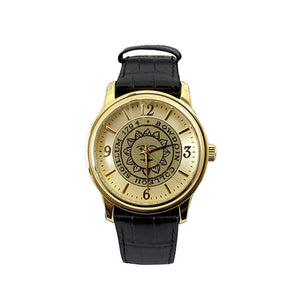 Gold tone wristwatch with black strap. Bowdoin sun seal on face, which has gold hour markers with arabic numerals at 12, 3, 6, and 9.