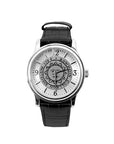 Silver tone wristwatch with black strap. Bowdoin sun seal on face, which has silver hour markers with arabic numerals at 12, 3, 6, and 9.
